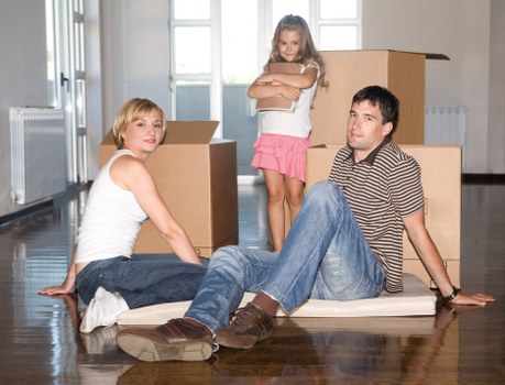 Packed household boxes and furniture prepared for transport during a Bayswater home move
